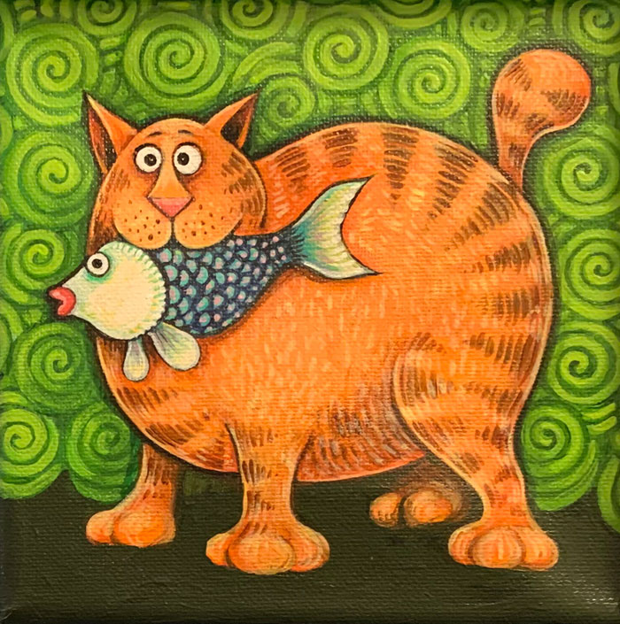 A fat orange cat with a fish
